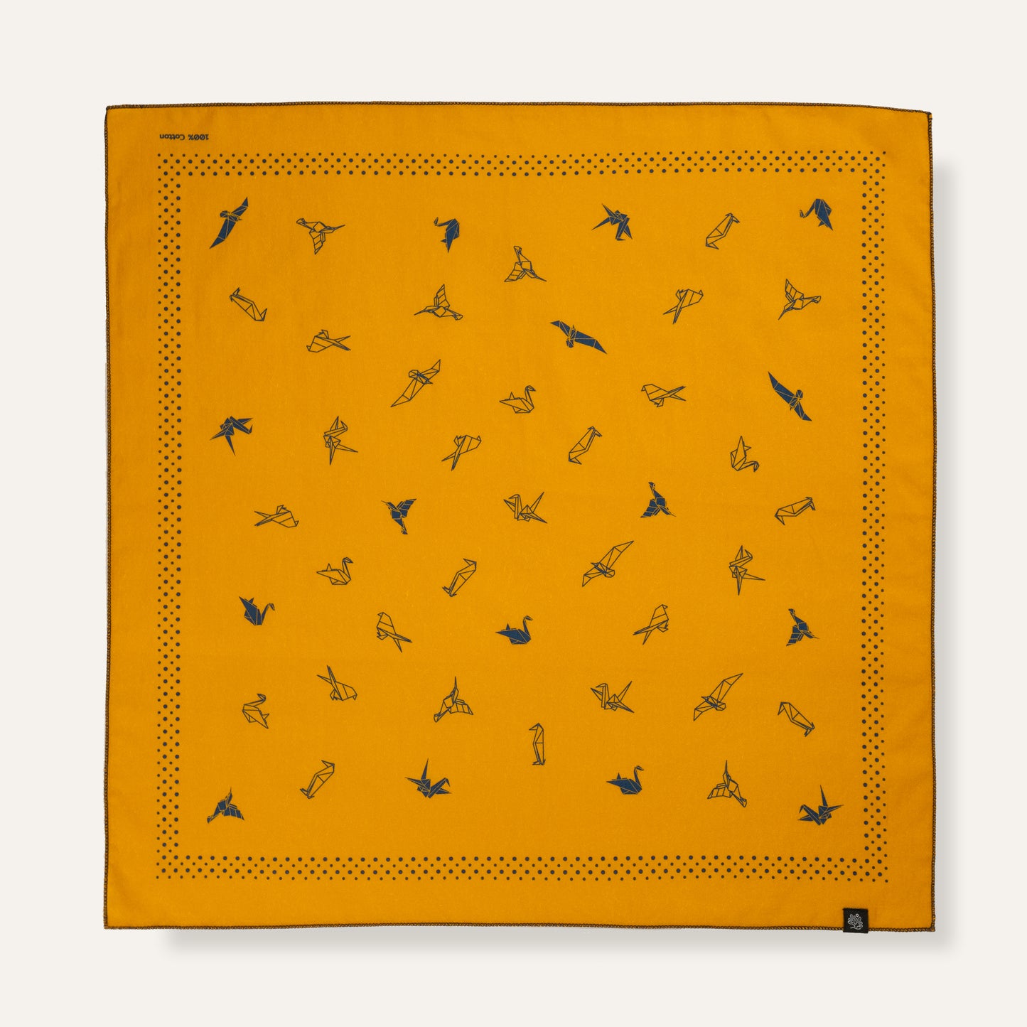 Orange bandana with black bird patterns on a white background