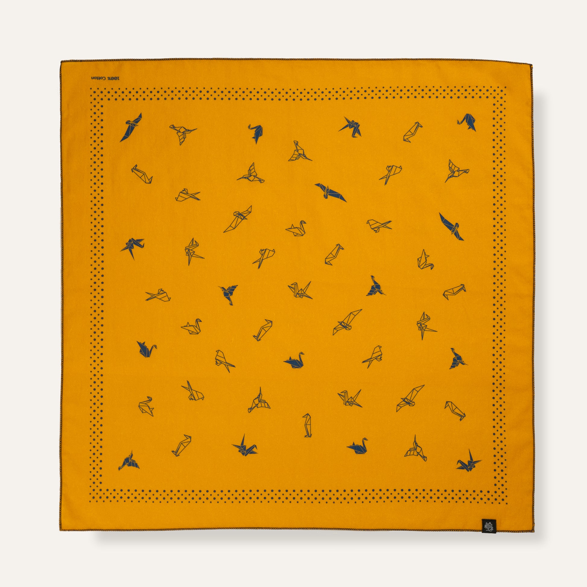 Orange bandana with black bird patterns on a white background