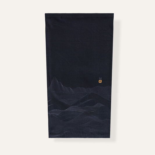 Black neck gaiter with mountain design on a white background