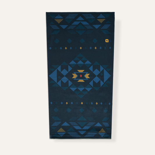 Navy blue neck gaiter with geometric pattern on a white background