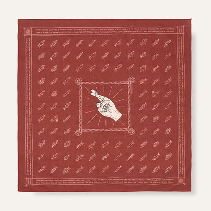 Red bandana with white patterns and central design on a white background