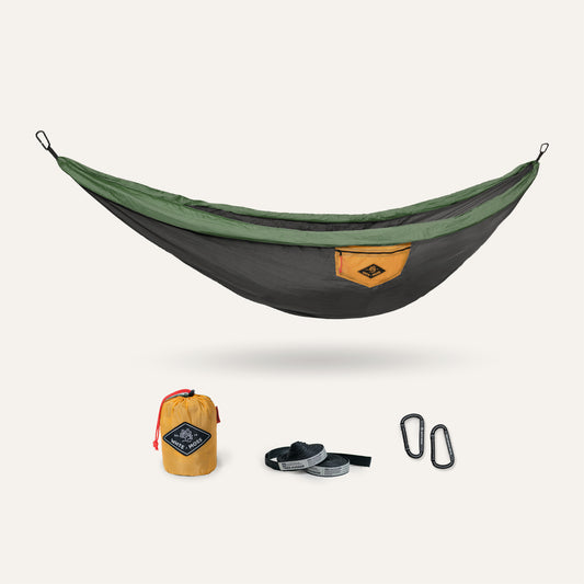 Hammock set with carrying bag, straps, and carabiner on a white background