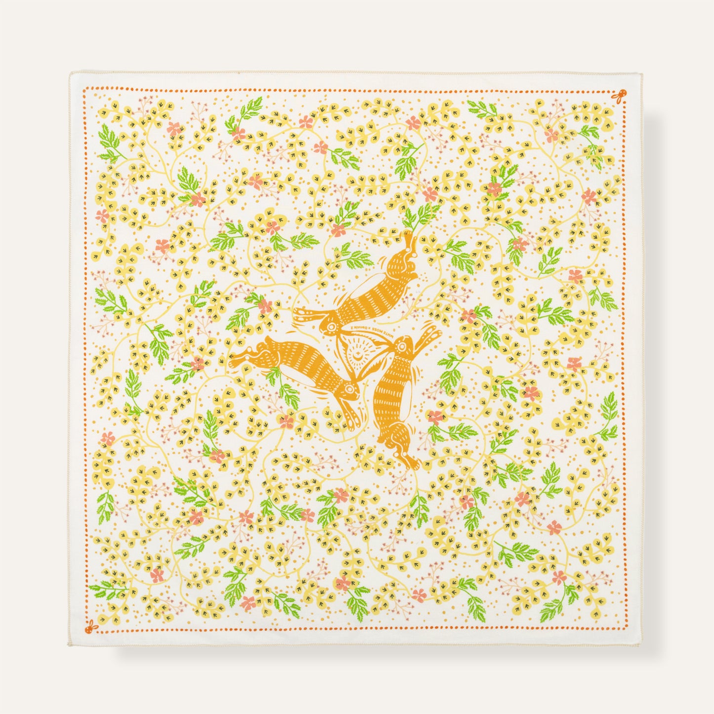Square scarf with orange fox and floral pattern on a white background
