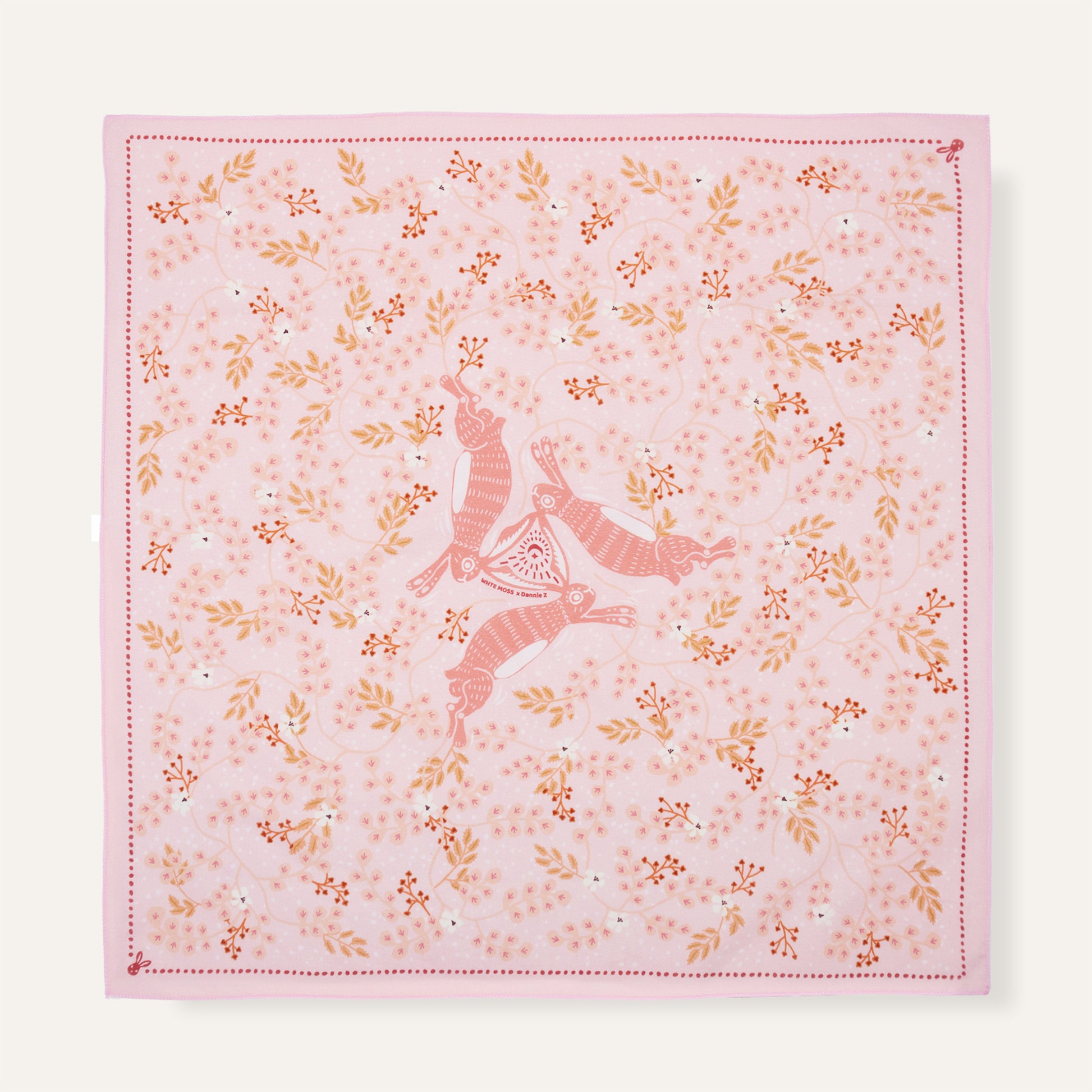 Pink fabric with floral patterns and a deer design on a white background