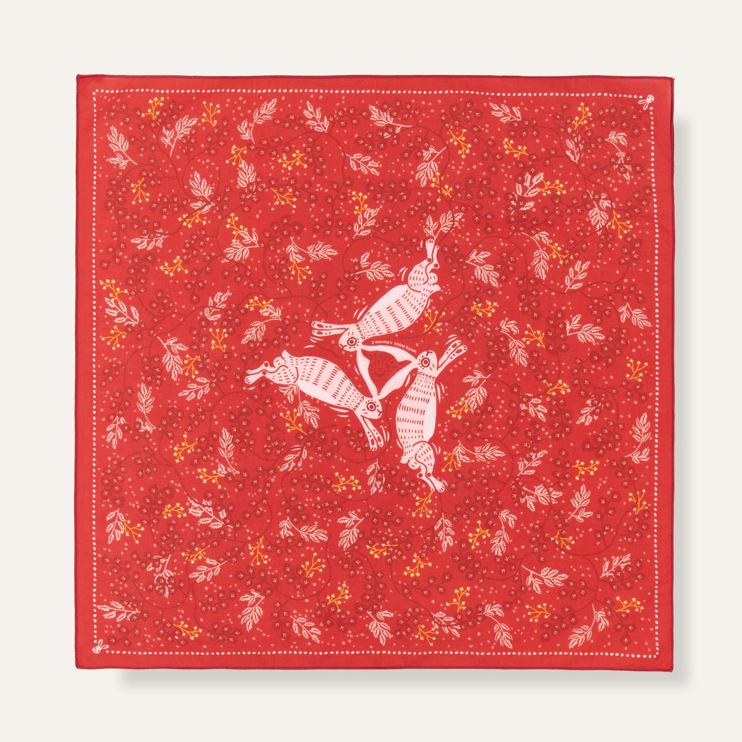 Red fabric with white rabbit pattern on a white background