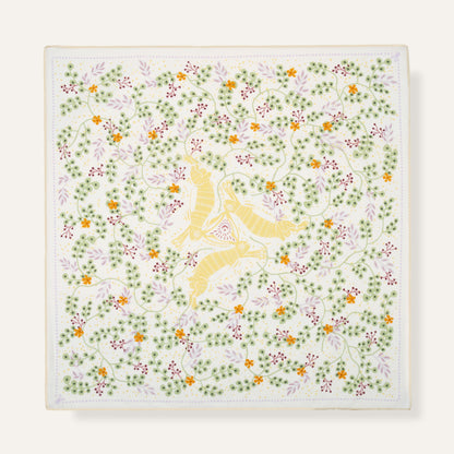 Decorative square with floral pattern and yellow center on a white background