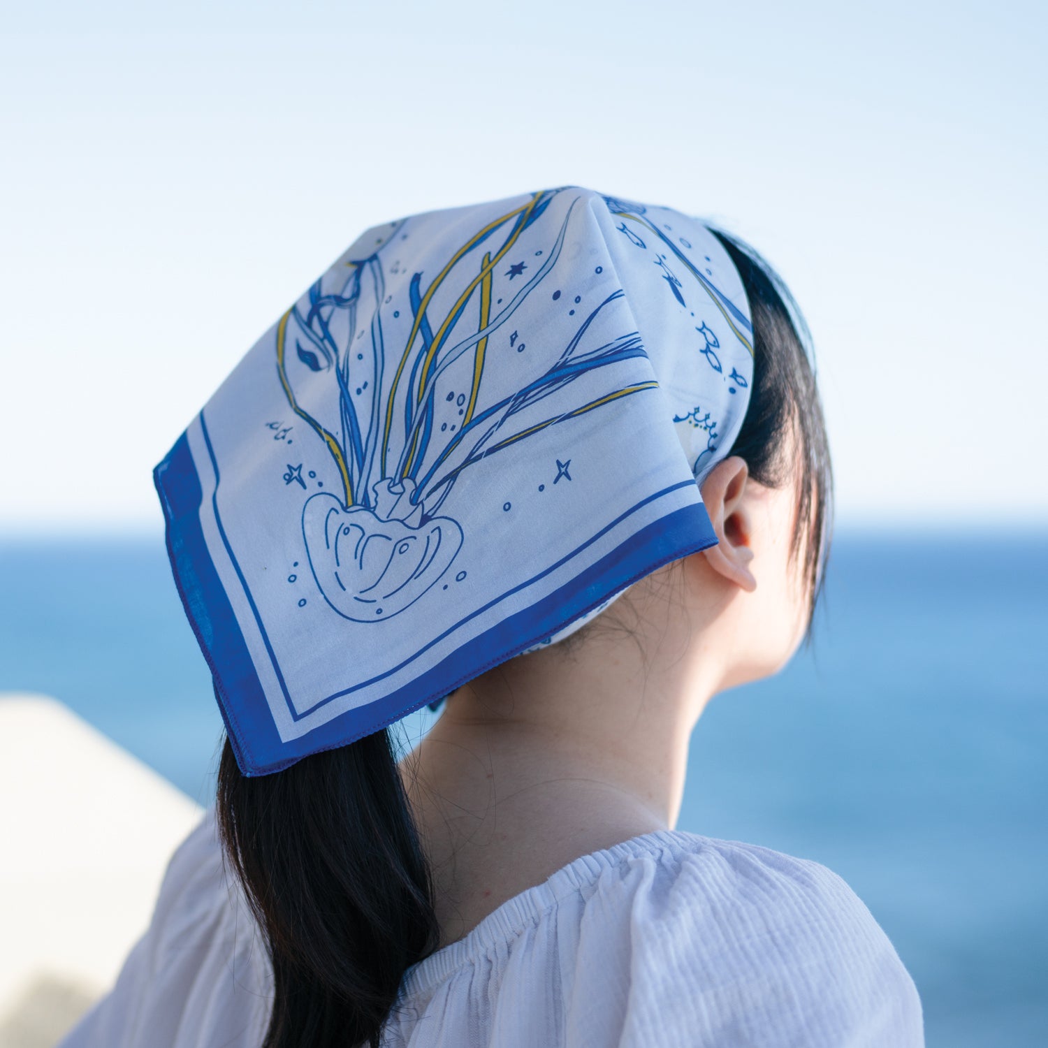 WHTE MOSS The Ocean Bandana | Light Blue - Macro shot of fabric texture of Designed in California. Durable and comfortable fo
